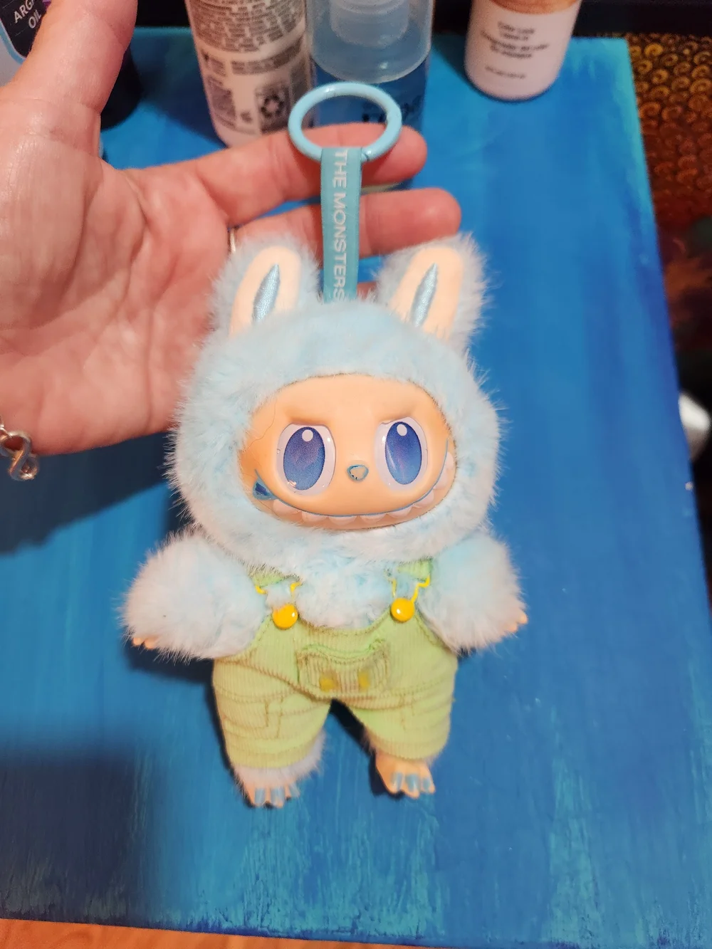 Blue Fuzzy Monster Lafufu Plush Keychain with Green Overalls